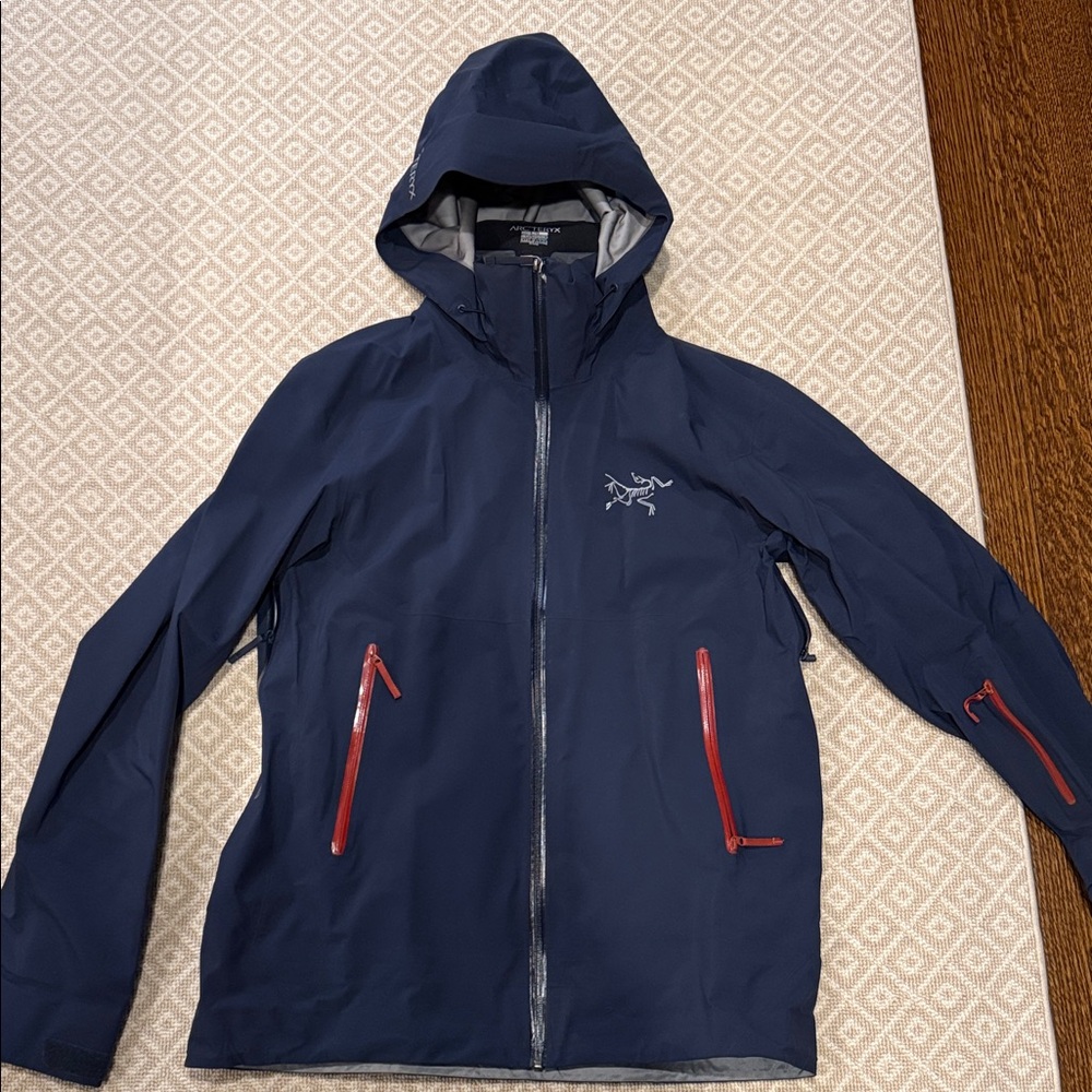 Arc'teryx Men's Dark Blue Performance Jacket with Red Accents
